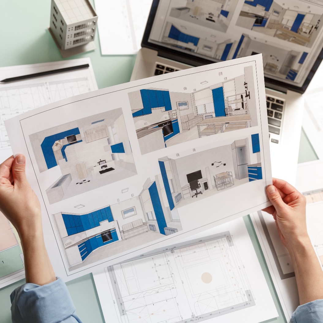 Innenarchitektin bei der Arbeit mit einer Küche, die in einem Designbüro gerendert wurde.